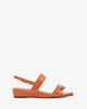 Coral colored croc wedge sandals