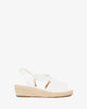 White faux leather sandals with jute wedge