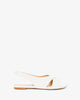 White faux leather flat sandals