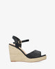 Black soft fabric sandal with a jute wedge