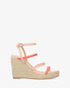 Salmon-colored soft fabric sandal with a jute wedge