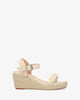 Beige faux suede sandal with a jute wedge