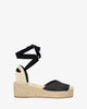 Wedge sandals in black-colored fabric with jute wedge