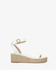 White soft sandals with a jute wedge