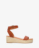 Brown soft sandals with a jute wedge