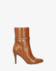 Heeled booties in soft camel faux leather