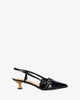Slingback black patent shoes with a kitten heel
