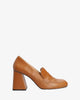Heeled loafers in brown leather