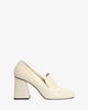Heeled loafers in off-white leather