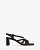 Strapped sandals in black split leather and square toe