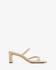 Mule en cuir noir à bout beige