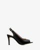 Chaussures talons en cuir couleur noir ouvertes à l´arrière.