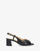 Heeled sandals in black leather