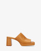 Heeled mules with platform in camel leather