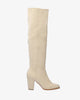 Heeled knee-high boots in off-white faux suede.