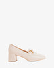 Heeled moccasins in white patent