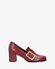 Heeled moccasins in burgundy faux croc leather and buckle detail