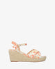 Orange-toned fabric sandal with a jute wedge