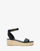 Black soft sandals with a jute wedge