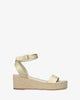 Gold soft sandals with a jute wedge