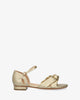 Flat sandals in soft golden colored material