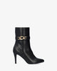 Heeled booties in soft black faux leather
