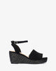 Black faux suede sandal with a jute wedge