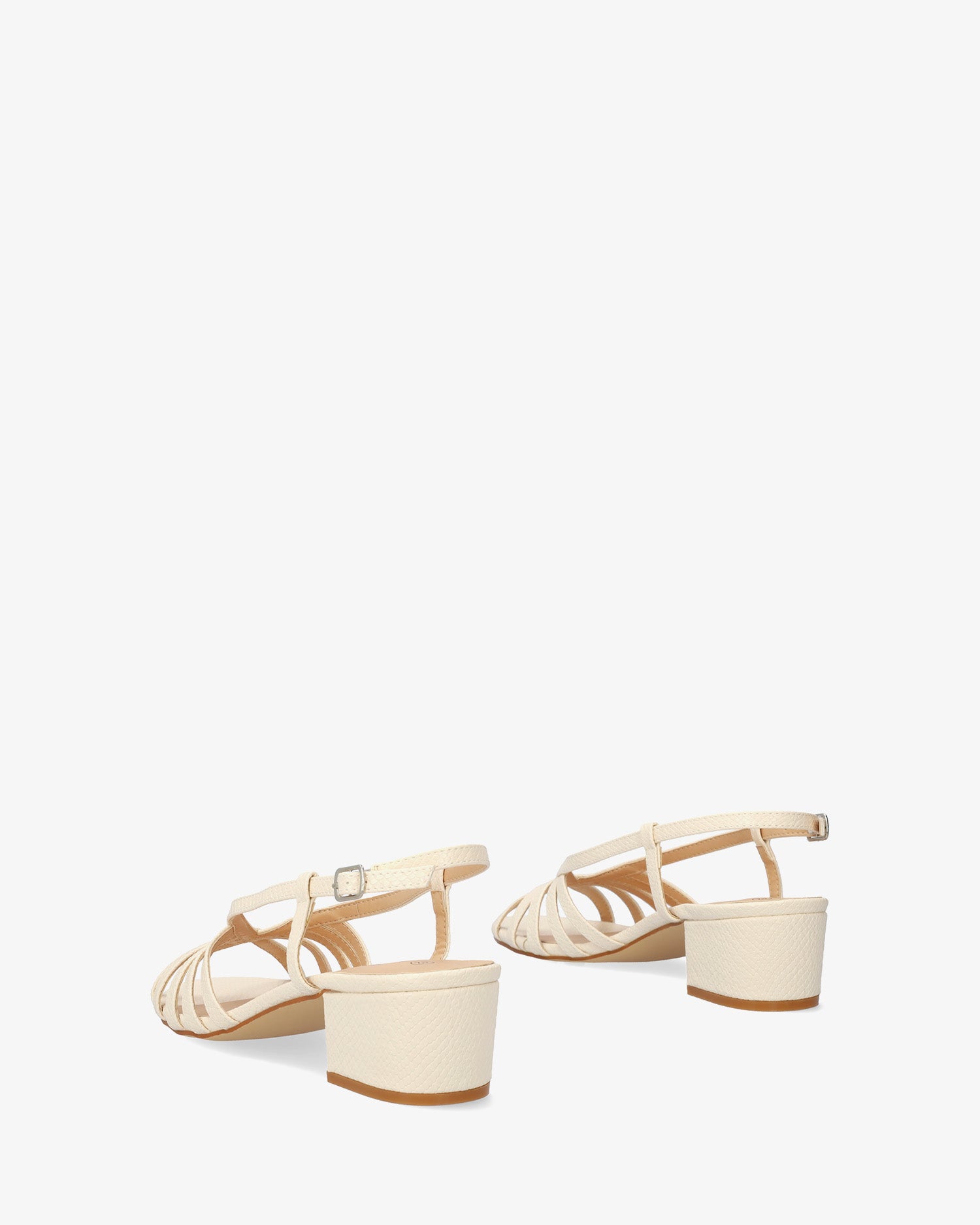 Soft ecru slingback sandal with a wide heel