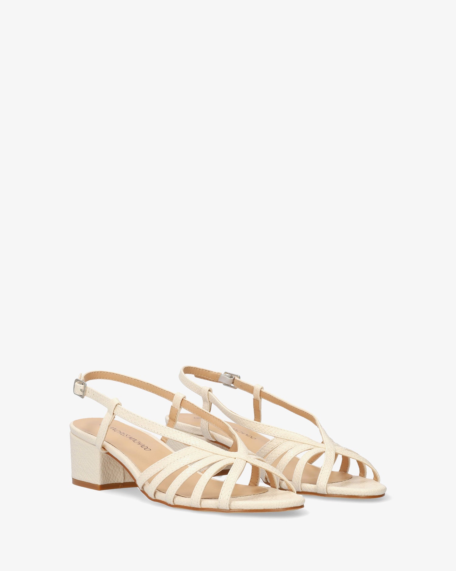 Soft ecru slingback sandal with a wide heel