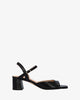 Heeled leather sandal in black colour
