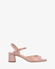 Heeled leather sandal in nude colour