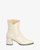 Bottines talon en cuir de couleur blanc cassé