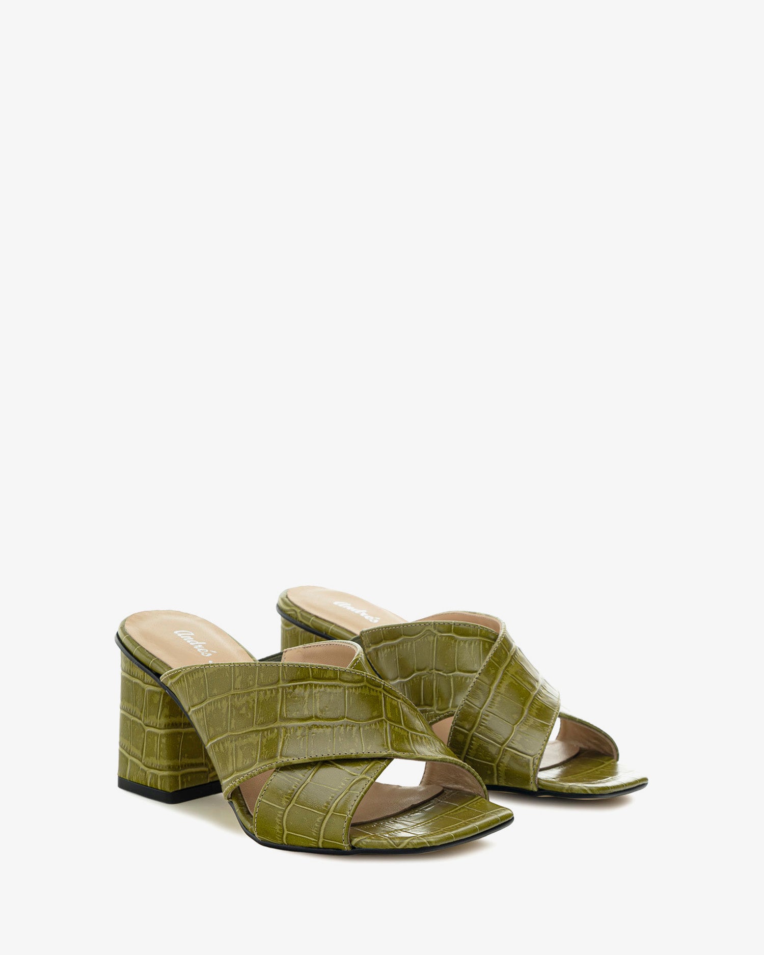 Mules aus grünem leder mit coco-prägung