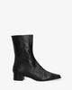 Heeled booties in black leather