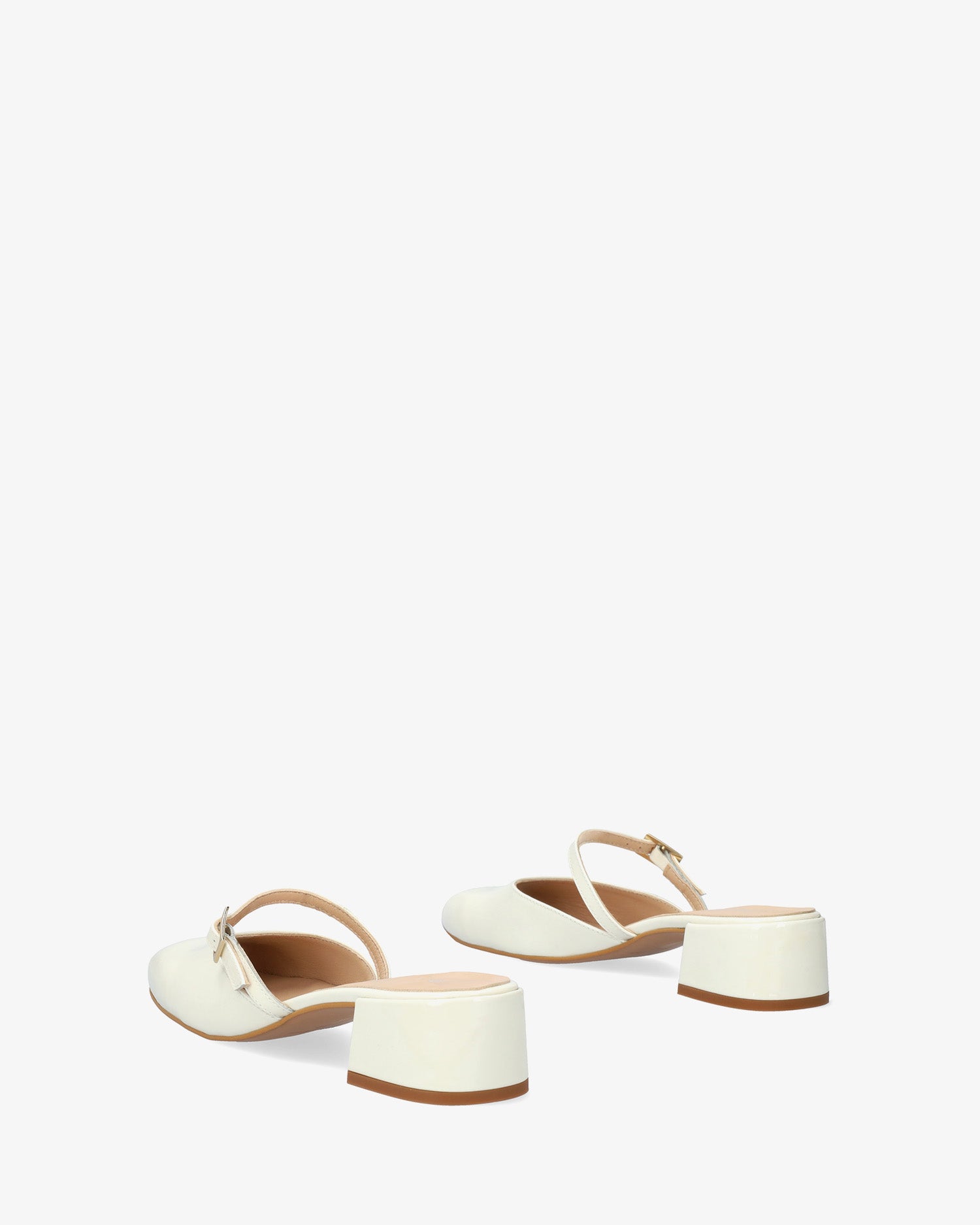 Mule con tacco in pelle verniciata bianco
