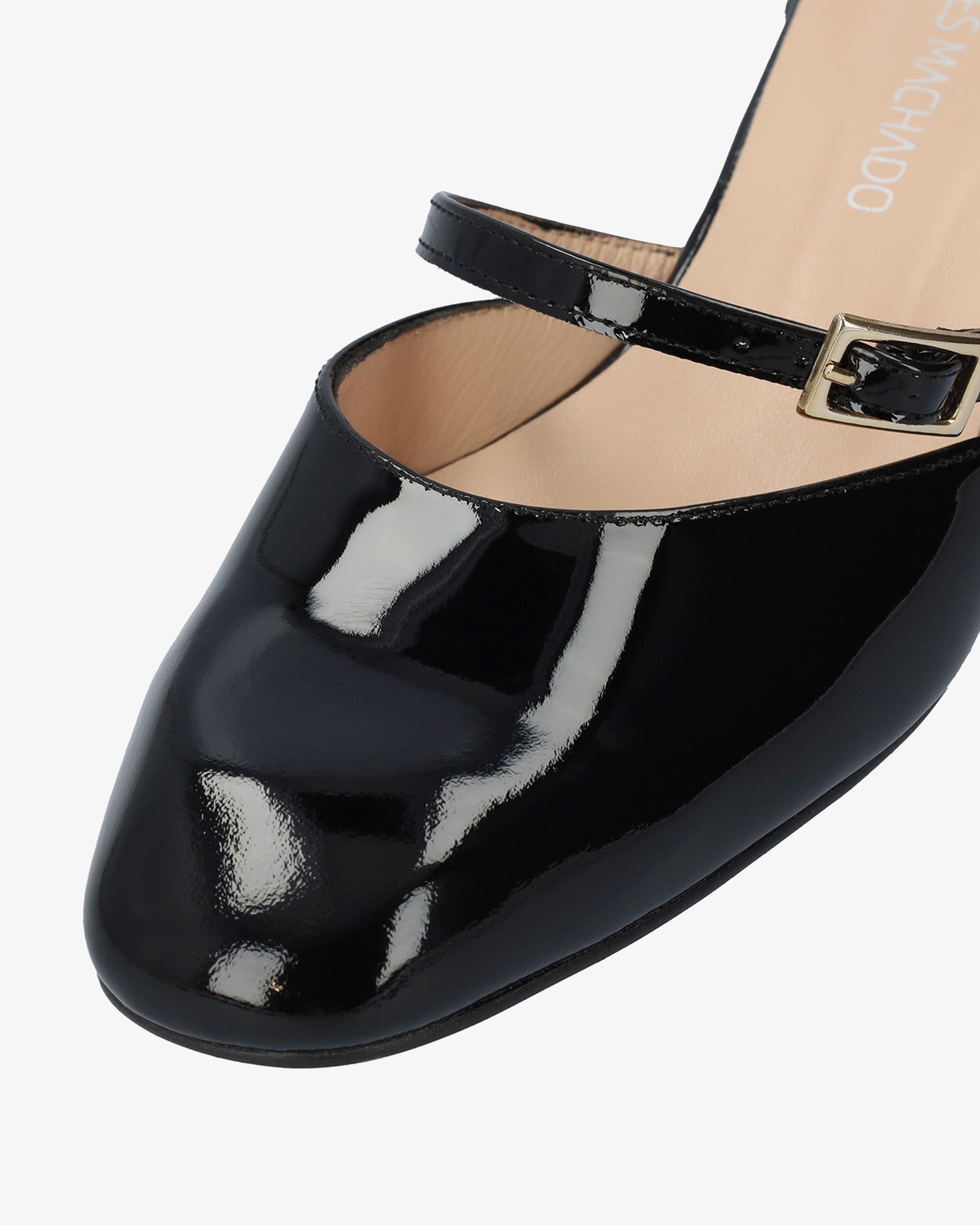 Heeled mule in black patent leather
