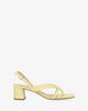 Heeled sandals in yellow leather