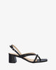 Heeled sandals in black leather