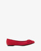 Red faux-pull-leather ballerinas with bow.