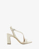 Crossover heeled sandals in cream leather