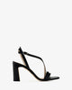 Crossover heeled sandals in black leather